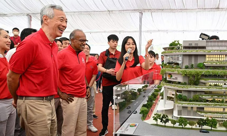 PM Lee Hsien Loong and Minister for Home Affairs and Minister for Law and Chong Pang MP K. Shanmugam viewing a model of Chong Pang City at its groundbreaking ceremony.